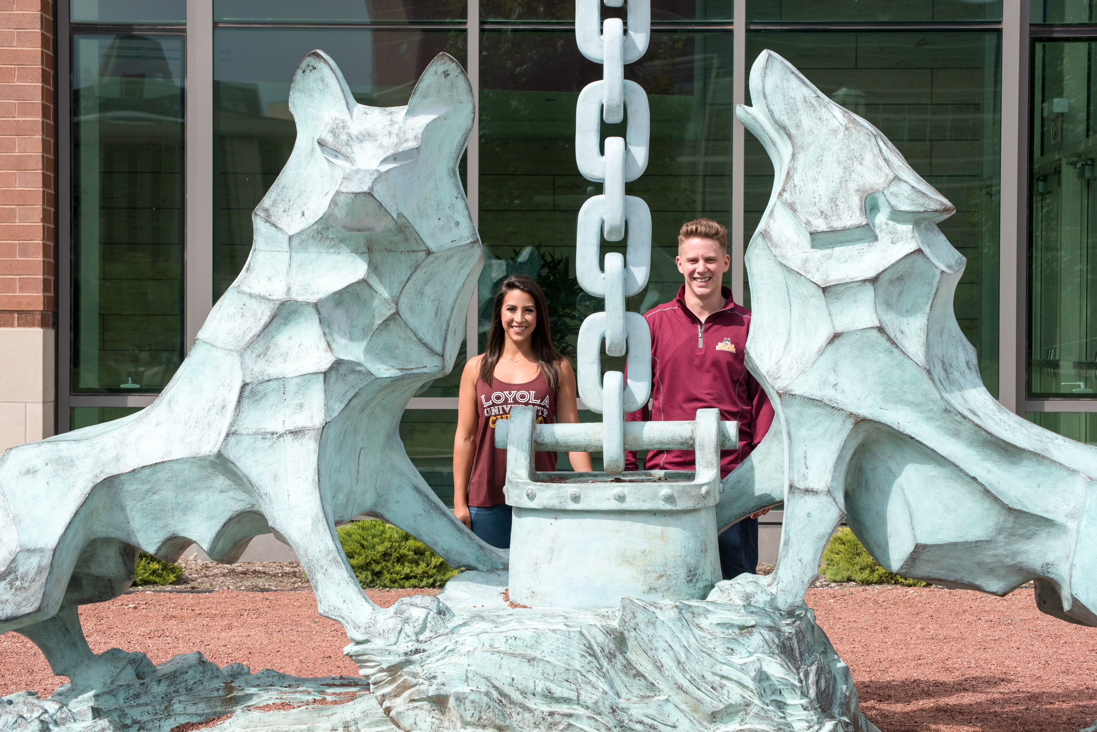 Lisa Lanigan, with husband Parker, at the Wolf and Kettle statue on the Lake Shore Campus